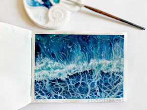 Painting of waves in sketchbook, by Susanna Lee @susaleena.art